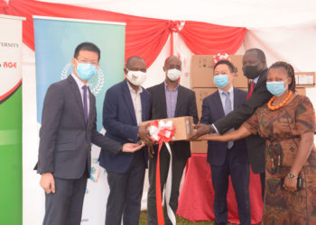 Huawei officials handing over ICT study equipment to Makerere University on Friday