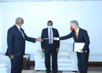 Minister Kutesa receiving copies of credentials from Germany's new Ambassador to Uganda