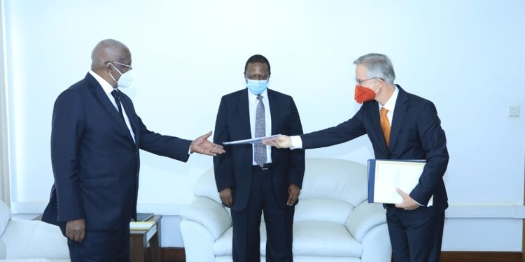 Minister Kutesa receiving copies of credentials from Germany's new Ambassador to Uganda