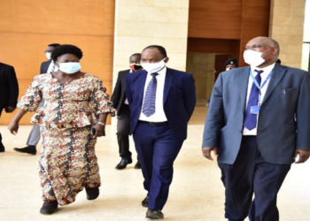 Speaker Rebecca Kadaga (L) Dr Maxime Houinato, the UN Women Country Representative and Dr Eddie Mukooyo of the Uganda AIDS Commission arriving for the function at the Office of the President