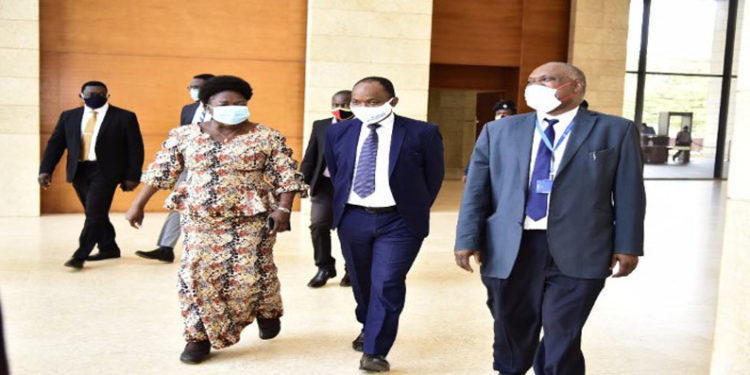 Speaker Rebecca Kadaga (L) Dr Maxime Houinato, the UN Women Country Representative and Dr Eddie Mukooyo of the Uganda AIDS Commission arriving for the function at the Office of the President