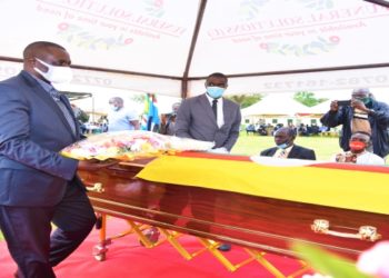 Rt Hon. Jacob Oulanyah, the Deputy Speaker of Parliament, laying a wreath on the casket containing Odida's remains in Pader district