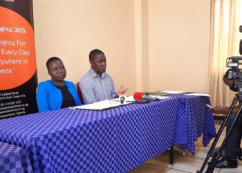 Unwanted Witness's boss Dorothy Mukasa and organization's head of legal department Allan Sempala Kigozi addressing the media on Tuesday