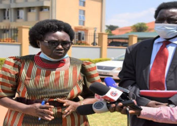 MPs Cecilia Ogwal (L) and Charles Angiro Abacacon addressing journalists after attending Police Disciplinary Court in Naguru, Kampala