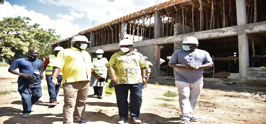 Oulanya(C) after touring construction works at the Arua stadium