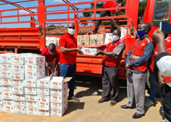 The Coca cola team led by Newton Lee Ogong, Events and Promotions Manager during the handover to Mukono Red Cross Society Manager Sam Mugisha