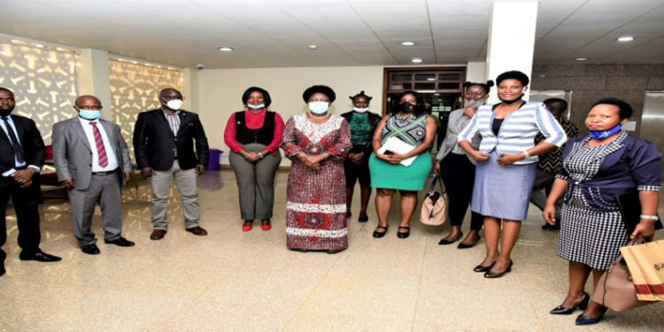 Speaker Rebecca Kadaga (C), Hon. Lyandro Komakech (3rd, Left) after meetng the LASPNET delegation over the Legal Aid Bill in Parliament