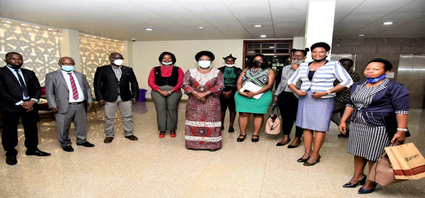 Speaker Rebecca Kadaga (C), Hon. Lyandro Komakech (3rd, Left) after meetng the LASPNET delegation over the Legal Aid Bill in Parliament