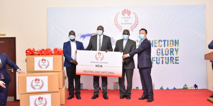 From Left to Right: Dr. Justus Kwetegeka, Dean Kyambogo, Hon. Bagirre Vicent Waiswa, Permanent Secretary Ministry of ICT and National Guidance, Prof John Chresestom Maviri, VC Uganda Martrys Nkozi University and Mr. Gaofei, Huawei MD with a demo of the donated equipment