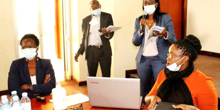 L-R: The Research Team; Dr. Rosemary Emegu Isoto (PI), Prof. Bernard Bashaasha (Co-PI and Principal, CAES), Ms. Caroline Kamugira and Ms. Noreen Munabi Nkuraija engage with stakeholders during the dissemination on 14th October 2020, Conference Hall, SFTNB, CAES, Makerere University, Kampala Uganda.