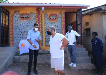 Rajiv Ruparelia inspects one of the eco toilets in Kamwokya