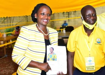 Musherure stands alongside NRM Electoral Commission boss Tanga Odoi