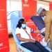 Airtel Uganda, the Customer Service Director Miss Lyndah Nabayinda donating blood at one of the centres