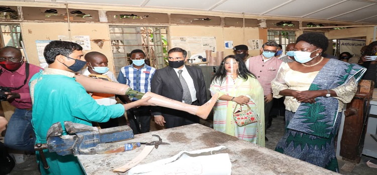 Speaker Kadaga(R) listens to one of the doctors from India