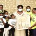 Speaker Rebecca Kadaga (C), the Clerk to Parliament, Jane Kibirige (left) and the Triplets Ghetto Kids, a dance group composed of children from the Katwe slum in Kampala district