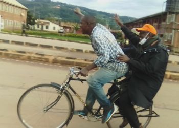Gen Tumukunde on a bicycle