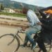 Gen Tumukunde on a bicycle