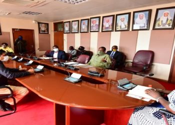 Speaker Kadaga(R) in a meeting with the directors of the sugar companies