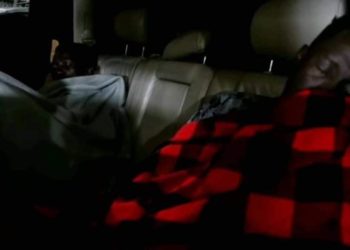 Bobi Wine and his right hand man Nubian Li sleeping in a car on Thursday