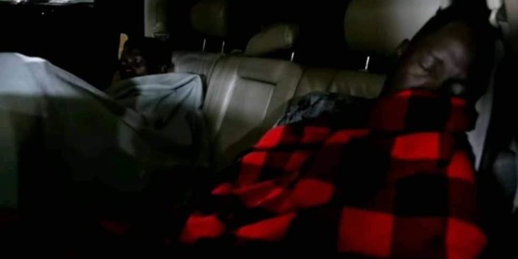 Bobi Wine and his right hand man Nubian Li sleeping in a car on Thursday