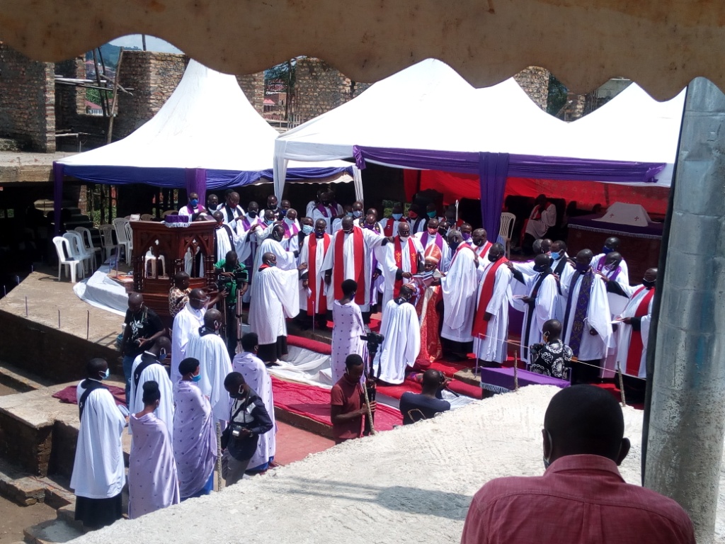 Rev Benon Magezi ordaining priests last year