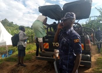 The deceased's body being taken to the mortuary for postmortem