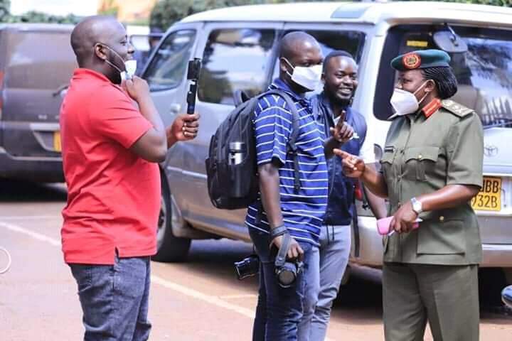 Some of the journalists after moving out Uganda Media Centre in protest