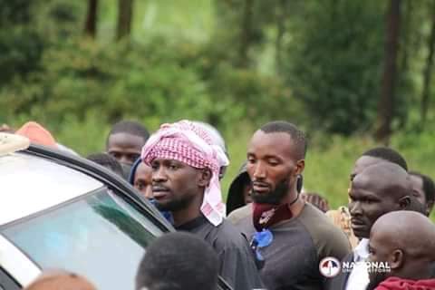 Bobi Wine and behind him is Norbert Elber Ariho