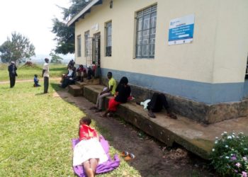 Patients waiting for health workers outside katete health center III building. photo by Ronald Kabanza.