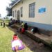 Patients waiting for health workers outside katete health center III building. photo by Ronald Kabanza.