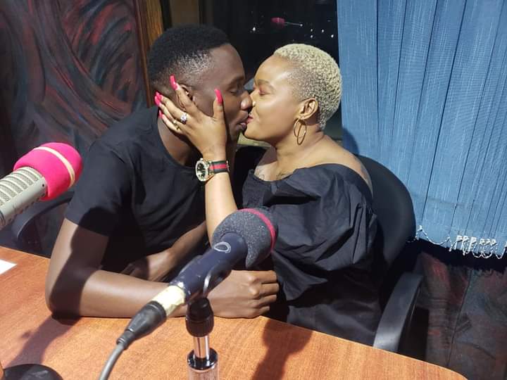 Don Zella kissing Tamale Mirundi's son