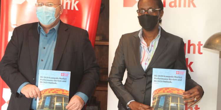 Marc du Toit (left) and Judy Rugasira Kyanda, the Knight Frank Uganda, Head of Retail and Managing Director respectively, at the release of the  H2 2020 Kampala Market Update Report.