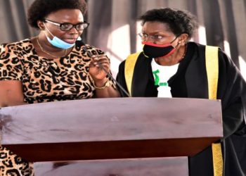 The Clerk to Parliament, Jane Kibirige (R) consulting with Hon. Jane Avur during the Wednesday, 17 February 2021 plenary sitting