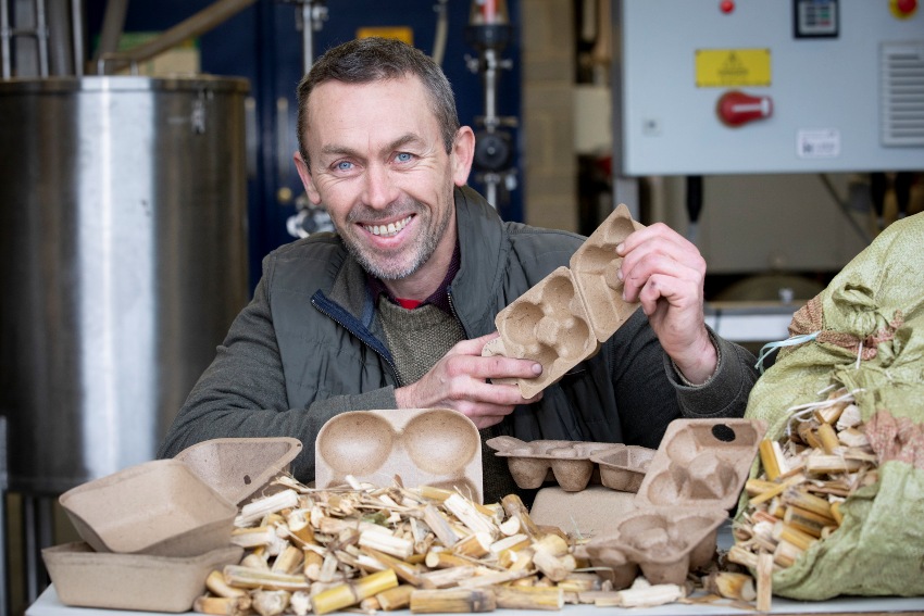 Llion Williams, Chief Technician at Bangor University’s BioComposites Centre, with the new packaging and the maize stover it is made from