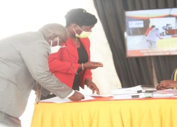 MPs consulting with a Parliament official during the plenary on Thursday in which the Leadership Code Bill was passed