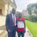 Nicholas Opiyo with Tumusiime