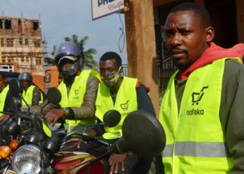 Nofeka delivery agents stationed outside their Kampala office waiting to serve customers