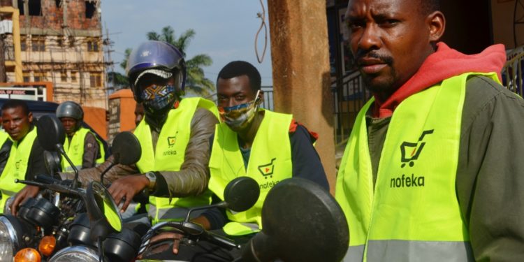 Nofeka delivery agents stationed outside their Kampala office waiting to serve customers