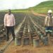 WIlson Sserunjogi, a farmer and sub county chief in Buwuma (left) with an official of Oil Palm Buvuma Ltd at an oil palm nursery in Buvuma.