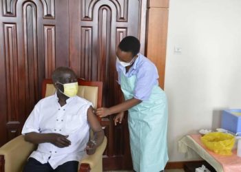 VP Ssekandi receiving his Covid-19 vaccine jab