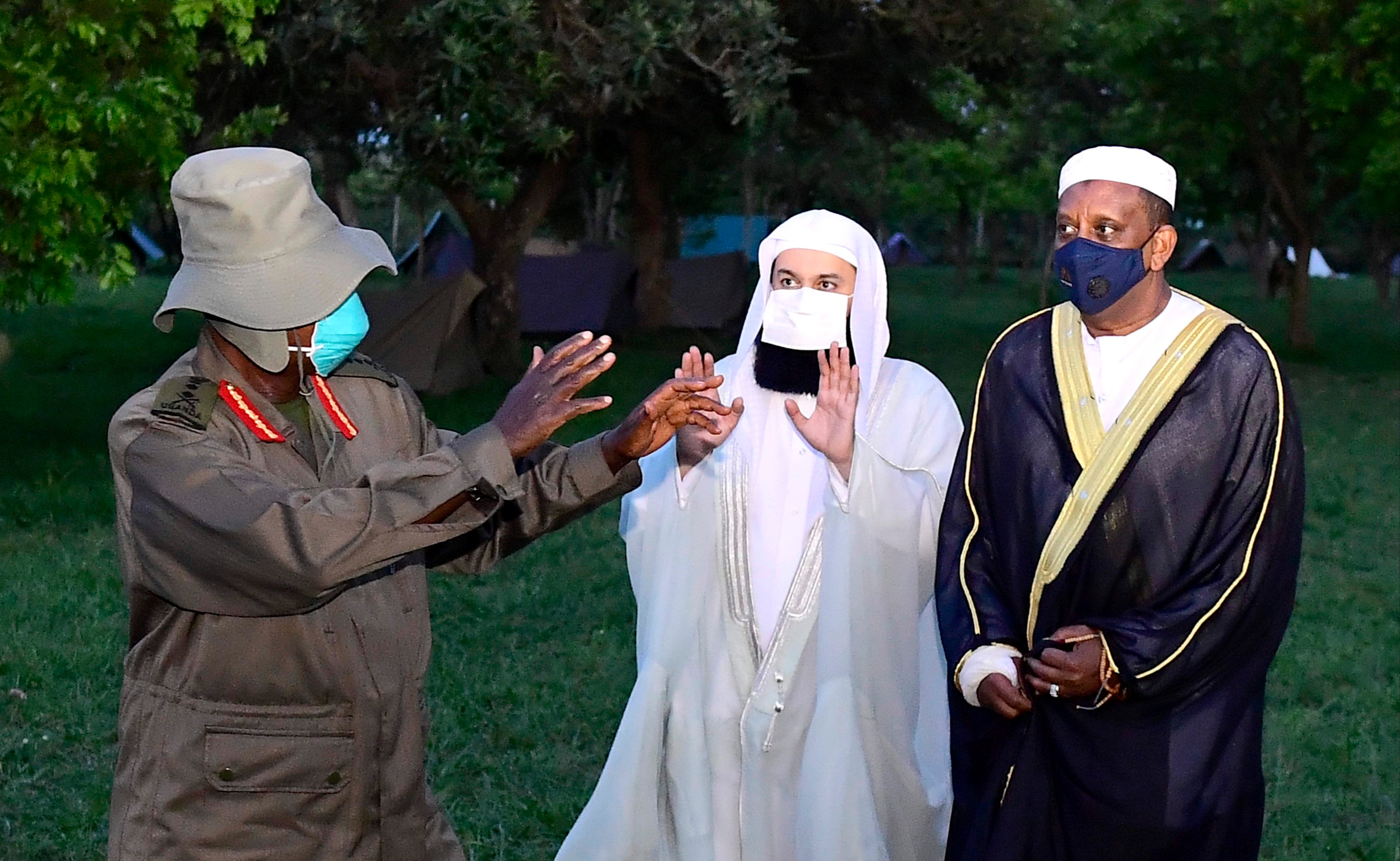 President Museveni and Sheikh Menk (middle) at Kyankwanzi State Lodge on Tuesday