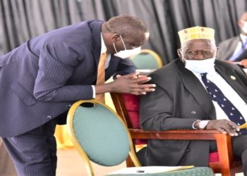 First Deputy Prime Minister, Gen. Moses Ali (R) consulting with Hon. Godfrey Onzima, Aringa North County MP during the Tuesday, 27 April 2021 sitting