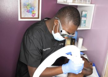 Dr. Ronald Katureebe carrying out a procedure on a patient recently