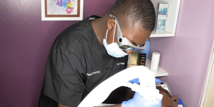 Dr. Ronald Katureebe carrying out a procedure on a patient recently