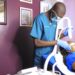 A Dermatologist at Kampala Dermatology clinic Bugolobi works on a patient using the specialised Aero lase Neo light Pod laser machine