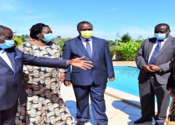 AGTs Njuki Nsubuga (L) receiving Speaker Rebecca Kadaga (2L) and Minister Elioda Tumwesigye (C) at the laboratory premises in Mukono district