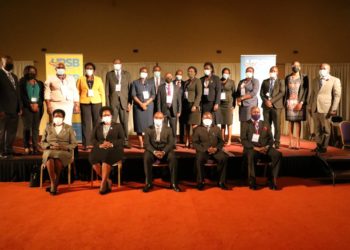 Principal Judge, Flavian Zeija (C), Registrar General, Mercy Kainobwisho (2nd L) in a group photo with other Judicial Officers during the training at Speke Resort, Munyonyo