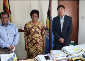 Lands Minister Beti Kamya (middle)