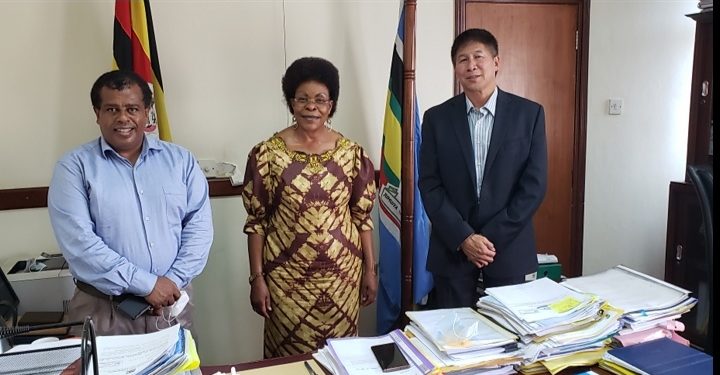 Lands Minister Beti Kamya (middle)