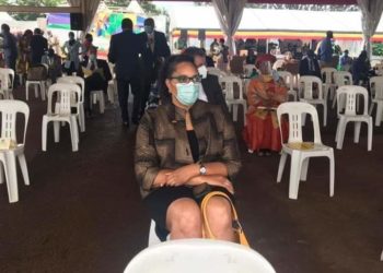 US Ambassador to Uganda Natalie Brown seated in a plastic chair at Museveni's swearing-in ceremony